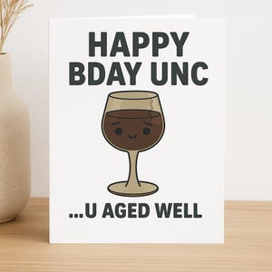May include: A white greeting card with the text "HAPPY BDAY UNC" in dark gray letters. Below the text is a cartoon wine glass filled with brown liquid. The text "...U AGED WELL" is at the bottom of the card.