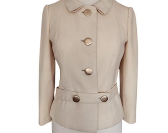 Chaqueta vintage estilo Mod de los años 60 de Marshall Field & Company. Chaqueta peplum de lana color crema.