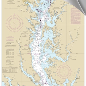 May include: A nautical chart of the Upper Chesapeake Bay, showing the waterways and shorelines of the region. The chart is printed in shades of blue, brown, and white, with red markings for navigational hazards. The chart includes a compass rose and a legend.