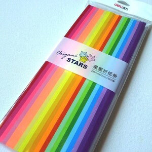 May include: A package of 1000 origami paper sheets in a rainbow of colors. The package is labeled "Origami Stars" and "235mmx10mm/1000 sheets".