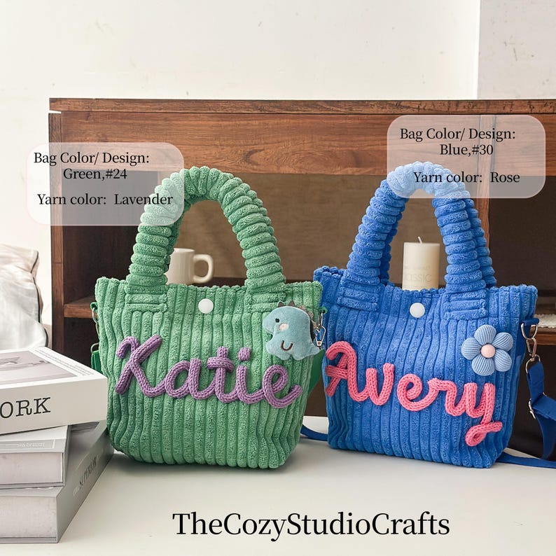 May include: Two corduroy tote bags, one green with lavender yarn and the name "Katie", the other blue with rose yarn and the name "Avery". Each bag has a handle, a button, and a small charm. TheCozyStudioCrafts.