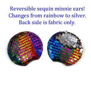 May include: Two reversible sequin Minnie Mouse ear headbands. One ear is rainbow colored, the other is blue and silver. The text reads: "Reversible sequin minnie ears! Changes from rainbow to silver. Back side is fabric only."