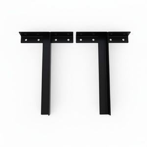 May include: Two black metal shelf brackets in a T-shape. Each bracket has a flat top with pre-drilled holes for mounting and a vertical support. The brackets are designed for supporting shelves and other items.