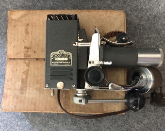 Vintage SVE Picturol Model Q Film Strip Projector with 30 film strips. Circa 1940.