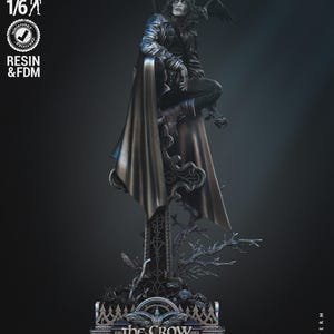 May include: A detailed, black and silver 1/6 scale resin statue of The Crow, a fictional character from the comic book series of the same name. The statue depicts the character sitting on a tombstone with a raven perched on his shoulder. The base of the statue features the words "The Crow" and "In Memory of Brandon Lee".