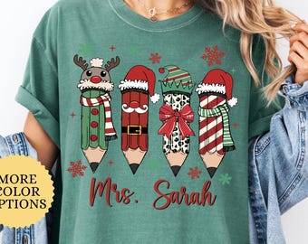 Comfort Colors® Personalized Christmas Teacher Shirt, Santa Hat Pencil Bow Tee, Coquette Teacher Name Tee, Xmas Classroom Teacher Shirt