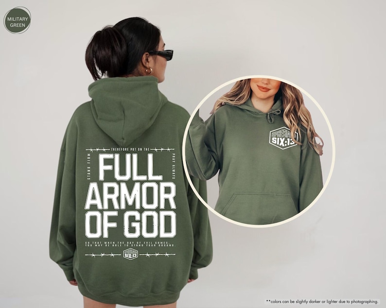 May include: Military green hoodie with the text "FULL ARMOR OF GOD" in white block letters. The back of the hoodie features additional text and the logo "SIX:13". The front of the hoodie has the "SIX:13" logo on the upper left chest.