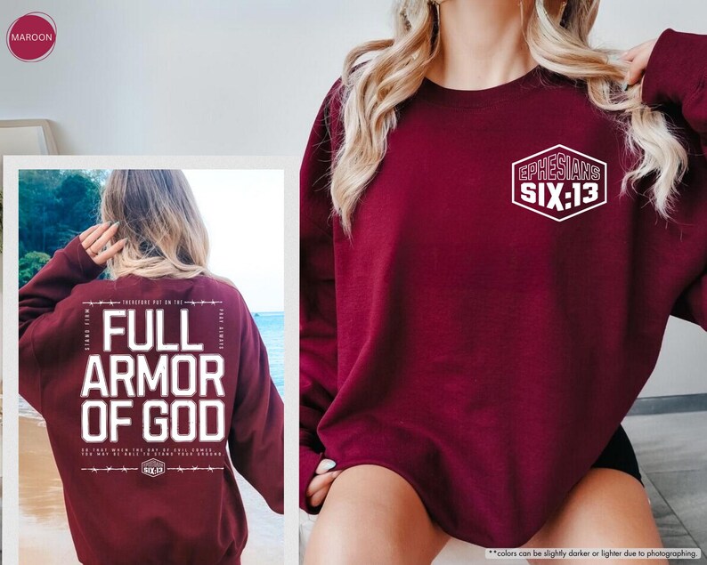 May include: Maroon sweatshirt with the text "FULL ARMOR OF GOD" on the back and "EPHESIANS SIX:13" on the front. The sweatshirt is a solid maroon color.