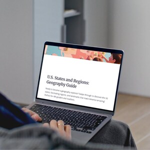 May include: A laptop displaying a webpage titled "U.S. States and Regions: Geography Guide." The screen shows a map and text inviting readers to explore the 50 states and their regions. The laptop is open, and the user's hands are visible on the keyboard.