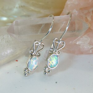 Bright White Opal Earrings ~ Light oval opals set in 925 sterling silver with swirl and silver drop accents, elegant dangle earrings
