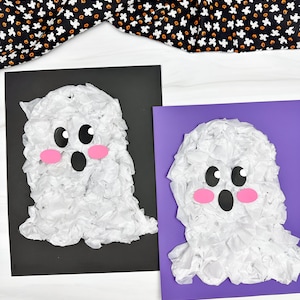 May include: Two handmade ghost crafts made of white tissue paper, black and pink paper. One ghost is on a black background, the other on a purple background. The ghosts have black eyes and mouths, and pink cheeks. A black and orange Halloween-themed fabric is in the background.
