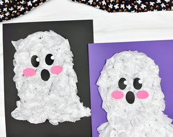May include: Two handmade ghost crafts made of white tissue paper, black and pink paper. One ghost is on a black background, the other on a purple background. The ghosts have black eyes and mouths, and pink cheeks. A black and orange Halloween-themed fabric is in the background.