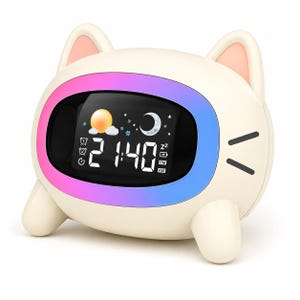 May include: A cream-coloured digital alarm clock shaped like a cat with pink-lined ears and black whiskers. The central screen displays the time 21:40, weather icons including a sun and moon, and battery status, surrounded by a vibrant rainbow-coloured light ring.