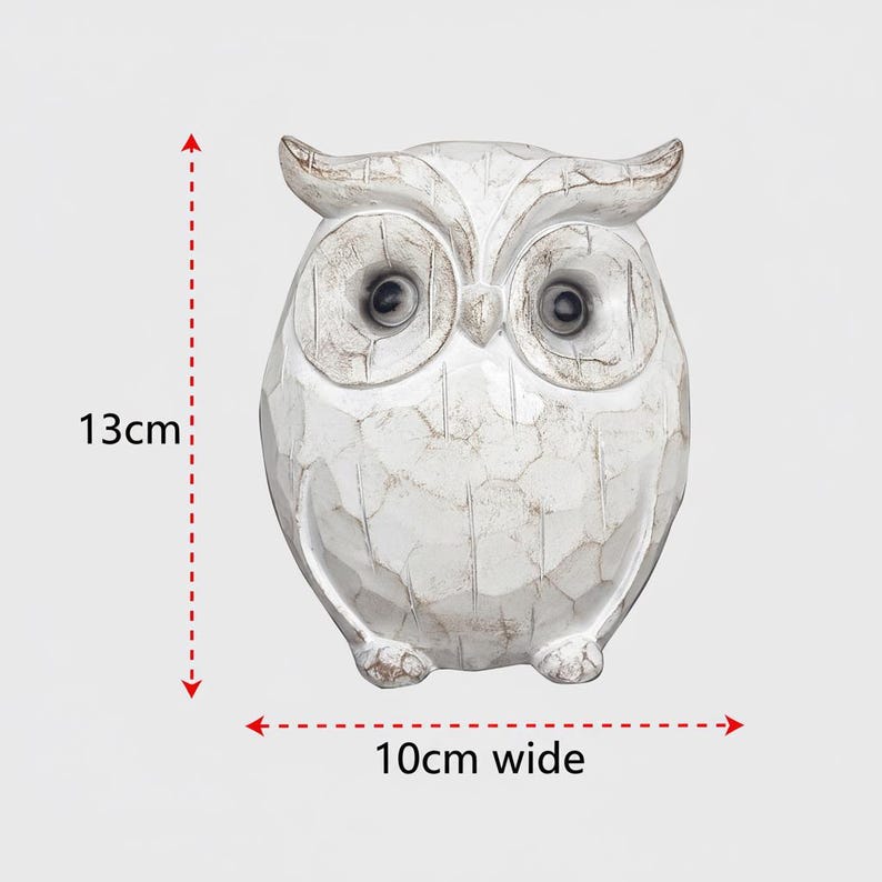 May include: A white owl figurine, 5 inches tall and 4 inches wide, with a distressed finish. The owl has large, dark eyes and a textured surface, giving it a rustic appearance. The figurine is a decorative item.