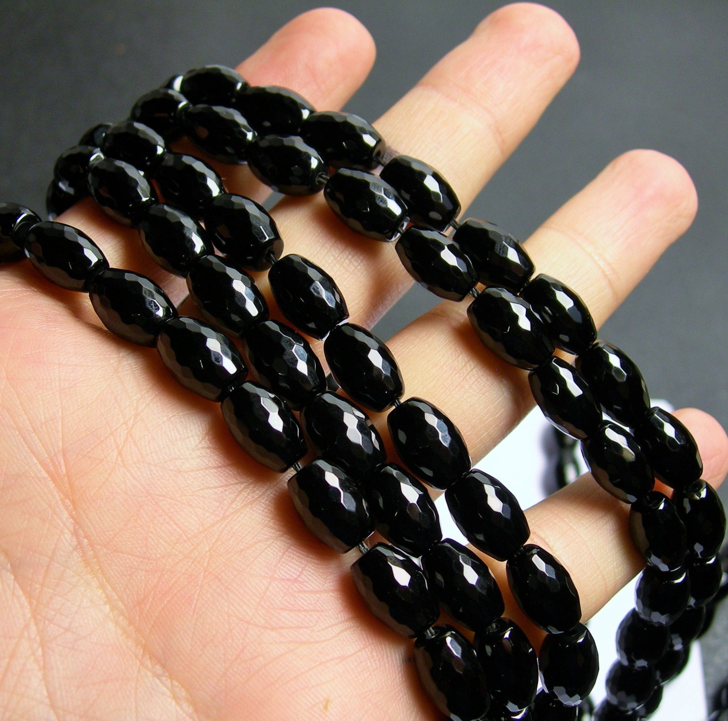 Black Onyx 8x12mm faceted oval beads 1 full strand 33 beads AA