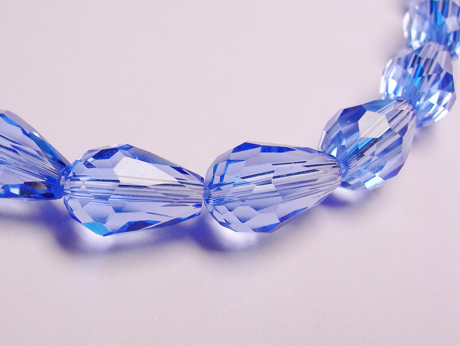 Faceted teardrop crystal beads 20 pcs 11 mm by 7mm clear blue NCBS2