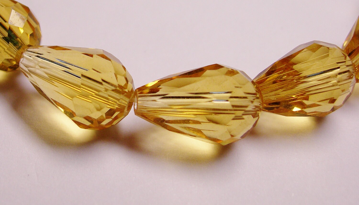 Faceted teardrop crystal beads 12 pcs 14mm by 9mm amber