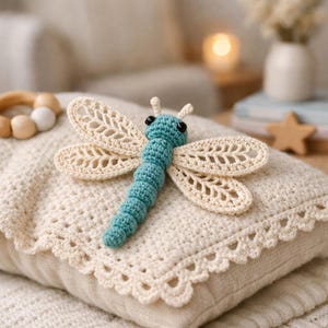 May include: A white ceramic mug with a black handle and the text "But First, Coffee" in a bold, black font. The mug is set against a blurred background, suggesting a cozy setting. The mug appears to be 12 ounces.