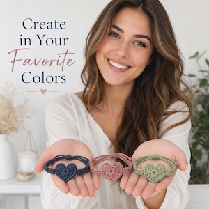 May include: Three handmade crochet heart bracelets in navy blue, dusty rose, and sage green. Each bracelet features a central heart-shaped motif with a thin adjustable cord. The text "Create in Your Favorite Colors" is displayed above the bracelets.
