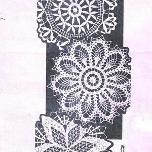 May include: Three crocheted doilies in different patterns. The doilies are white and are arranged in a vertical stack. The top doily has a starburst pattern, the middle doily has a floral pattern, and the bottom doily has a more geometric pattern. The words "CROCHETED DOILIES" are printed below the doilies.