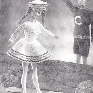 May include: A black and white photo of two dolls. The doll on the left is wearing a white crocheted dress with a black and white trim, a white crocheted hat, and ice skates. The doll on the right is wearing a dark sweater with a white letter C on the front and dark pants.
