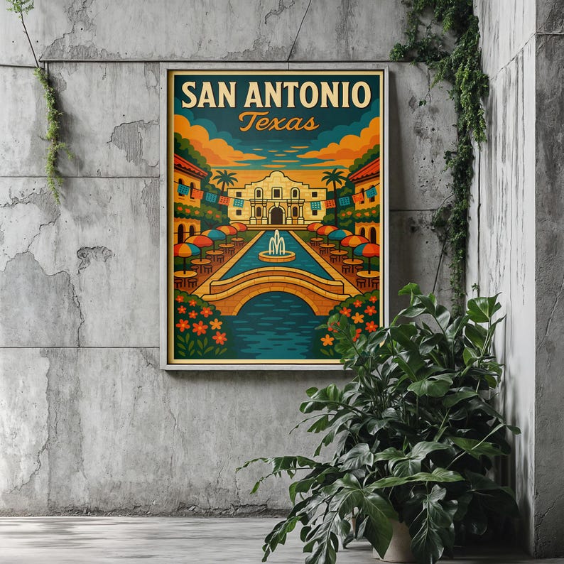 May include: A framed San Antonio, Texas art print. The artwork features a colorful illustration of the Alamo, a bridge over a river, and buildings with umbrellas. The text "SAN ANTONIO Texas" is at the top of the print.