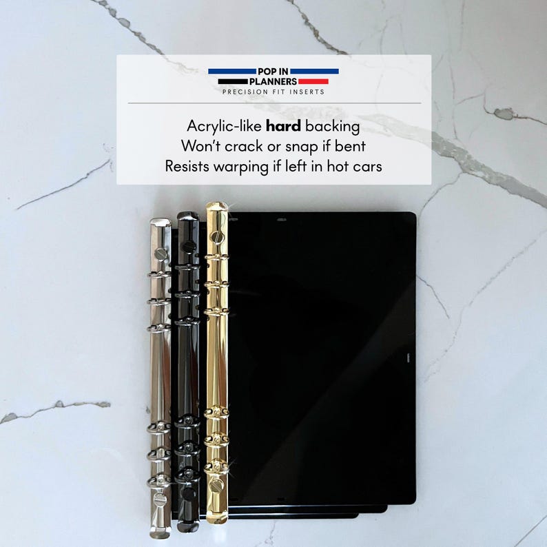 May include: Three rectangular black planner inserts with metallic ring binders in silver, black, and gold. The text reads: POP IN PLANNERS PRECISION FIT INSERTS. Acrylic-like hard backing. Won't crack or snap if bent. Resists warping if left in hot cars.