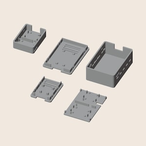 May include: A set of five grey plastic components for an electronic enclosure, including a rectangular main housing with side cutouts, a flat base plate, and three smaller internal mounting frames with various slots and raised support pegs.