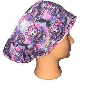 May include: A white ceramic mug with a black handle and the text "But First, Coffee" in a bold, black font. The mug is set against a blurred background, suggesting a cozy setting. The mug appears to be approximately 4 inches tall.