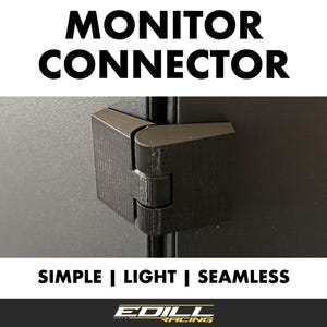以下が含まれることがあります： ヒンジ付きの黒いプラスチック製のモニターコネクタ。コネクタには「MONITOR CONNECTOR」と「SIMPLE | LIGHT | SEAMLESS」のラベルが貼られており、「EDILL RACING」のロゴが付けられています。
