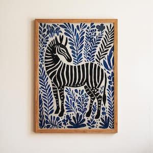 May include: A framed art print featuring a black and white zebra against a backdrop of blue foliage. The artwork is encased in a natural wood frame, creating a striking contrast. The zebra is the focal point, with detailed stripes.