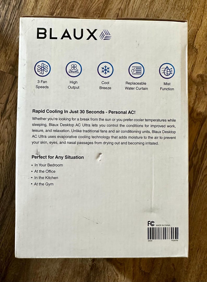 Puede incluir: Caja blanca para un Blaux Desktop AC Ultra. Incluye 3 velocidades de ventilador, alto rendimiento, brisa fresca, cortina de agua reemplazable y funci&oacute;n de niebla. El texto describe un enfriamiento r&aacute;pido en 30 segundos y es perfecto para cualquier situaci&oacute;n.