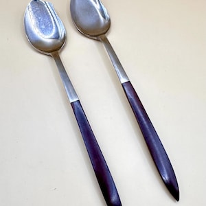 May include: A rustic wooden sign with the text "Welcome to our home" in white lettering. The sign features a distressed finish and a simple, inviting design, perfect for a front porch or entryway.