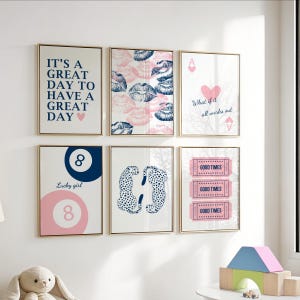May include: Set of six framed art prints with gold frames. The prints feature various designs, including text that reads "It's a great day to have a great day", lip prints, playing card symbols, a pool ball, leopard print, and "Good Times" tickets.