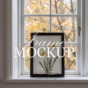 May include: A black framed art print mockup with a floral design, set against a white window. The text "Frame MOCKUP" is overlaid on the image. Includes a "PSD Smart Object" and "5:7 Ratio" label.