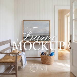 May include: A coastal-themed interior scene featuring a framed landscape painting above a wooden console table. A woven bench with a straw seat and a basket filled with flip-flops and a blue towel add to the beachy aesthetic. The text "Frame MOCKUP" is overlaid on the image.