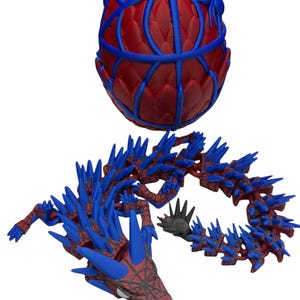 May include: A 3D-printed dragon and egg, featuring a red and blue color scheme. The egg has a lattice design, while the dragon has a spiky, segmented body. The dragon's head is detailed with a web-like pattern.