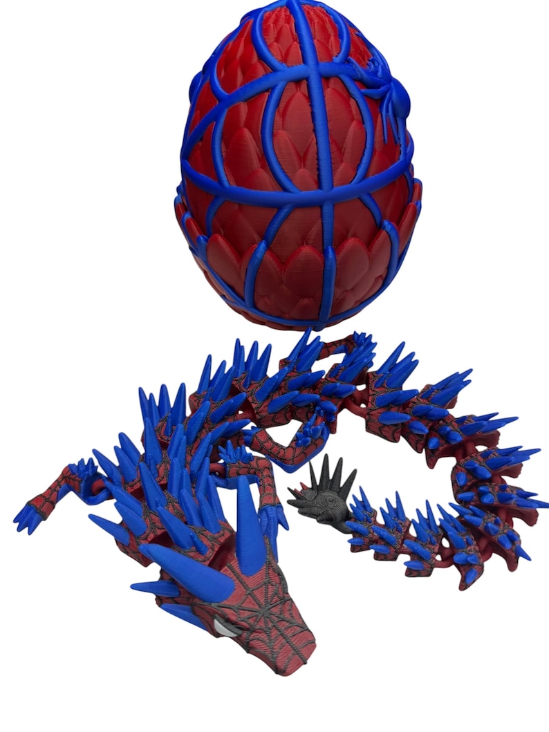 May include: A 3D-printed dragon and egg, featuring a red and blue color scheme. The egg has a lattice design, while the dragon has a spiky, segmented body. The dragon's head is detailed with a web-like pattern.
