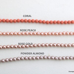 May include: Four horizontal strands of round beads arranged in rows. The top row is labeled CORAL, the second row is labeled ROSE PEACH, the third row is labeled ROSE GOLD, and the bottom row is labeled POWDER ALMOND. Each strand features uniform beads.