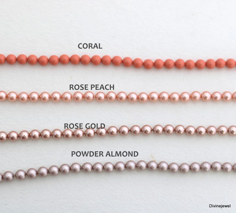May include: Four horizontal strands of round beads arranged in rows. The top row is labeled CORAL, the second row is labeled ROSE PEACH, the third row is labeled ROSE GOLD, and the bottom row is labeled POWDER ALMOND. Each strand features uniform beads.