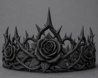 May include: A matte black crown featuring a detailed design of three dimensional roses intertwined with sharp, pointed thorns. The structure is circular with a central rose flanked by two smaller roses, all connected by a dense network of thorny vines.