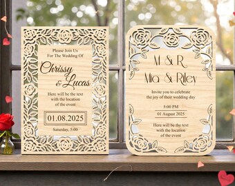 May include: Two wooden wedding invitations with floral cut-out designs. One invitation reads "Chrissy & Lucas" with the date "01.08.2025". The other reads "M & R Mia & Riley" with the date "01 August 2025".