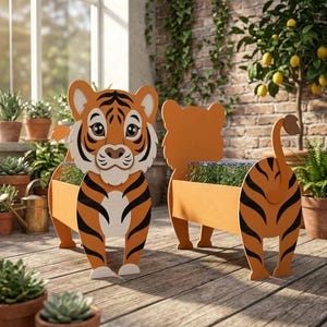 May include: Two wooden tiger-shaped planters. The planters are orange with black stripes and white accents. The tiger's face is detailed with eyes, a nose, and whiskers. The planters are filled with green plants and are on a wooden deck.