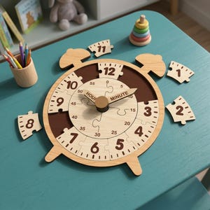 May include: A wooden clock puzzle featuring a light wood face with dark brown accents, movable hands labeled HOUR and MINUTE, and detachable puzzle pieces for numbers 1 through 12. The clock displays minute markers from 0 to 55 in increments of 5.