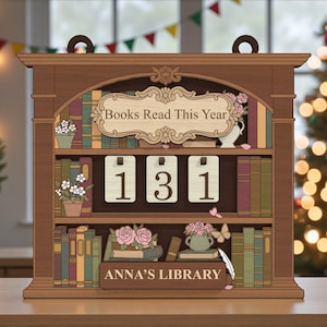 May include: Wooden bookshelf-shaped calendar with the text "Books Read This Year" and the number "131". The bookshelf has three shelves with decorative books, flowers, and the text "Anna's Library".