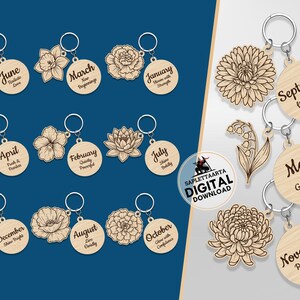 May include: Wooden keychains with floral designs and months of the year. Each keychain features a different flower and a corresponding month with an inspirational phrase. The keychains are attached to silver keyrings.