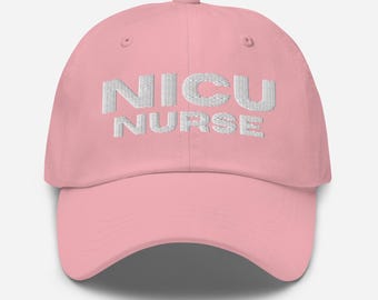 May include: A pale pink baseball cap featuring the embroidered words "NICU NURSE" in white. The cap has a curved peak and an adjustable strap at the back. A classic, casual hat.