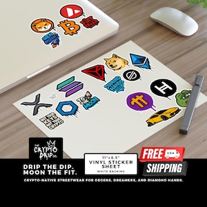 May include: A sheet of vinyl stickers featuring cryptocurrency-themed designs, including logos and phrases like "To the Moon" and "Not Your Keys, Not Your Crypto." The stickers are on a white backing, with a laptop and mouse in the background.
