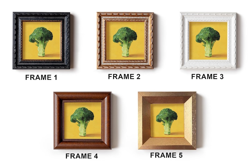 May include: Five framed art prints featuring a broccoli still life on a yellow background. Frames vary in style: black, ornate brown, white, dark brown, and gold. Each frame is labeled with the word "FRAME" and a number.