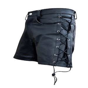 May include: Black leather shorts with a button closure, belt loops, and a single pocket. The shorts feature a lace-up design on the side with metal grommets and a drawstring. The garment is made of a smooth, matte material.